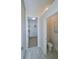 Elegant bathroom with a walk-in shower and marble flooring at 7814 Hidden Creek Loop # 104, Lakewood Ranch, FL 34202