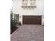 Modern home exterior with a two-car garage at 7814 Hidden Creek Loop # 104, Lakewood Ranch, FL 34202