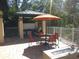 Outdoor patio with seating, grill, and fire pit at 7814 Hidden Creek Loop # 104, Lakewood Ranch, FL 34202