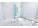 Clean bathroom with granite countertop and bathtub at 7814 Hidden Creek Loop # 104, Lakewood Ranch, FL 34202