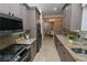 Modern kitchen with granite countertops and stainless steel appliances at 7814 Hidden Creek Loop # 104, Lakewood Ranch, FL 34202