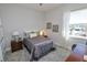 Simple bedroom with full bed and window at 7780 Hidden Creek Loop # 104, Lakewood Ranch, FL 34202