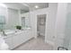 Modern bathroom with double vanity and a separate toilet area at 7780 Hidden Creek Loop # 104, Lakewood Ranch, FL 34202