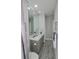 Clean bathroom with vanity and large mirror at 7780 Hidden Creek Loop # 104, Lakewood Ranch, FL 34202