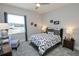 Bright bedroom with a queen bed, large window, and ample closet space at 7780 Hidden Creek Loop # 104, Lakewood Ranch, FL 34202