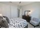 Spacious bedroom with a full bed, large closet, and sitting area at 7780 Hidden Creek Loop # 104, Lakewood Ranch, FL 34202