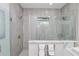 Large walk-in shower with modern tile and fixtures at 7780 Hidden Creek Loop # 104, Lakewood Ranch, FL 34202