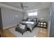 Bright and airy bedroom with hardwood floors and large windows at 7780 Hidden Creek Loop # 104, Lakewood Ranch, FL 34202