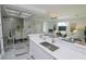 Modern kitchen with a large island, stainless steel appliances, and open floor plan at 7780 Hidden Creek Loop # 104, Lakewood Ranch, FL 34202