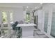 Modern kitchen with white cabinets and quartz countertops at 7730 Hidden Creek Loop # 102, Lakewood Ranch, FL 34202