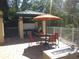 Relaxing poolside patio with grilling station and fire pit at 7730 Hidden Creek Loop # 102, Lakewood Ranch, FL 34202