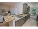 Spacious kitchen featuring granite countertops and gray cabinets at 7730 Hidden Creek Loop # 102, Lakewood Ranch, FL 34202