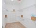 Large walk-in closet with wire shelving at 7730 Hidden Creek Loop # 102, Lakewood Ranch, FL 34202