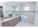 Bathroom with double vanity and walk-in shower at 7730 Hidden Creek Loop # 102, Lakewood Ranch, FL 34202