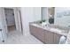 Double vanity bathroom with granite countertop at 7730 Hidden Creek Loop # 102, Lakewood Ranch, FL 34202