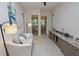 Spacious hallway with built-in cabinets and seating area at 7730 Hidden Creek Loop # 102, Lakewood Ranch, FL 34202