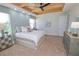 Bright main bedroom with light walls and ceiling fan at 7730 Hidden Creek Loop # 102, Lakewood Ranch, FL 34202