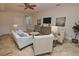 Spacious living room with ample seating and a neutral color scheme at 7730 Hidden Creek Loop # 102, Lakewood Ranch, FL 34202
