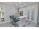 Modern kitchen with white cabinets and quartz countertops at 7730 Hidden Creek Loop # 102, Lakewood Ranch, FL 34202