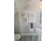 Small half-bathroom with pedestal sink and gray floor tile at 7834 Hidden Creek Loop # 104, Lakewood Ranch, FL 34202