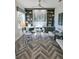 Spacious home office with built-in shelving and hardwood floors at 7834 Hidden Creek Loop # 104, Lakewood Ranch, FL 34202
