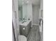 Elegant bathroom with a large mirror and gray marble vanity at 7834 Hidden Creek Loop # 104, Lakewood Ranch, FL 34202