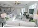Bright and airy living room featuring a comfortable sofa and stylish decor at 7834 Hidden Creek Loop # 104, Lakewood Ranch, FL 34202