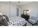 Charming bedroom with a full-size bed, and built-in shelving at 7834 Hidden Creek Loop # 104, Lakewood Ranch, FL 34202