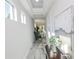 Bright hallway with marble floors and modern decor at 7834 Hidden Creek Loop # 104, Lakewood Ranch, FL 34202
