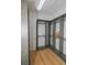 Spacious walk-in closet with custom built-ins and light wood floors at 7834 Hidden Creek Loop # 104, Lakewood Ranch, FL 34202