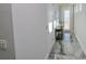 Modern hallway with marble floors and natural light at 7834 Hidden Creek Loop # 104, Lakewood Ranch, FL 34202