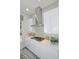 Modern kitchen with white cabinets and a sleek range hood at 7834 Hidden Creek Loop # 104, Lakewood Ranch, FL 34202
