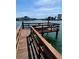 Private wooden boat dock with seating area, perfect for relaxing by the water at 44 Bayview S Ct # A, St Petersburg, FL 33711