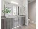 Modern bathroom with gray vanity and walk-in shower at 44 Bayview S Ct # A, St Petersburg, FL 33711