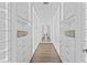 Bright walk-in closet with ample shelving and lighting at 44 Bayview S Ct # A, St Petersburg, FL 33711