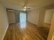 Spacious living area featuring wood-look floors and sliding glass doors at 5380 4Th N St # 203, St Petersburg, FL 33703