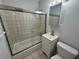 Updated bathroom featuring a shower/tub, vanity, and toilet at 5380 4Th N St # 203, St Petersburg, FL 33703
