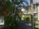 Exterior view of apartment building showcasing landscaping at 5380 4Th N St # 203, St Petersburg, FL 33703
