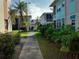 Paved walkway through a lush, tropical landscape at 5380 4Th N St # 203, St Petersburg, FL 33703