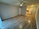 Bright living room with wood-look floors and access to the kitchen at 5380 4Th N St # 203, St Petersburg, FL 33703