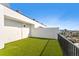 This spacious balcony features artificial turf and provides views of the surrounding neighborhood at 15405 Gulf Blvd # B1, Madeira Beach, FL 33708