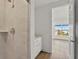 Bathroom featuring a tiled shower and a vanity with a quartz countertop at 15405 Gulf Blvd # B1, Madeira Beach, FL 33708