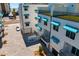 Modern condo exterior with stylish awnings and a paved courtyard entrance to the garage at 15405 Gulf Blvd # B1, Madeira Beach, FL 33708