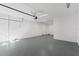 Spacious garage interior features an automatic garage door, bright lighting, and sealed floors at 15405 Gulf Blvd # B1, Madeira Beach, FL 33708