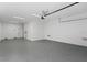 The spacious garage features painted walls, an automatic door, and a sealed floor at 15405 Gulf Blvd # B1, Madeira Beach, FL 33708
