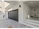 Modern garage entry featuring an electric door and access to the front entrance at 15405 Gulf Blvd # B1, Madeira Beach, FL 33708