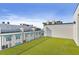 Rooftop featuring a green turf, a railing and water views at 15405 Gulf Blvd # B1, Madeira Beach, FL 33708