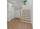 Beautiful staircase features wood and white finishes with natural light at 15405 Gulf Blvd # B1, Madeira Beach, FL 33708