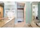 Spa-like bathroom with granite vanity and shower at 1363 Oceanview Dr, Tierra Verde, FL 33715
