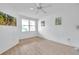 Cozy bedroom with a ceiling fan, bright windows, and wood-look floors creating a welcoming atmosphere at 1200 Country Club Dr # 6103, Largo, FL 33771